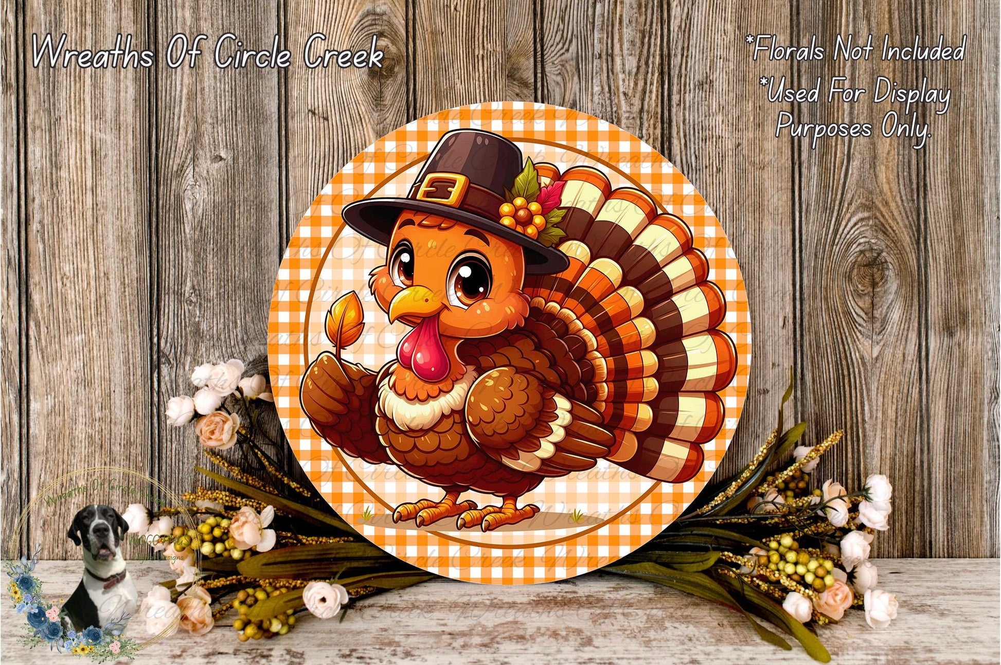 A cheerful cartoon turkey wearing a hat and holding a leaf, surrounded by a wreath of flowers and a wooden background.