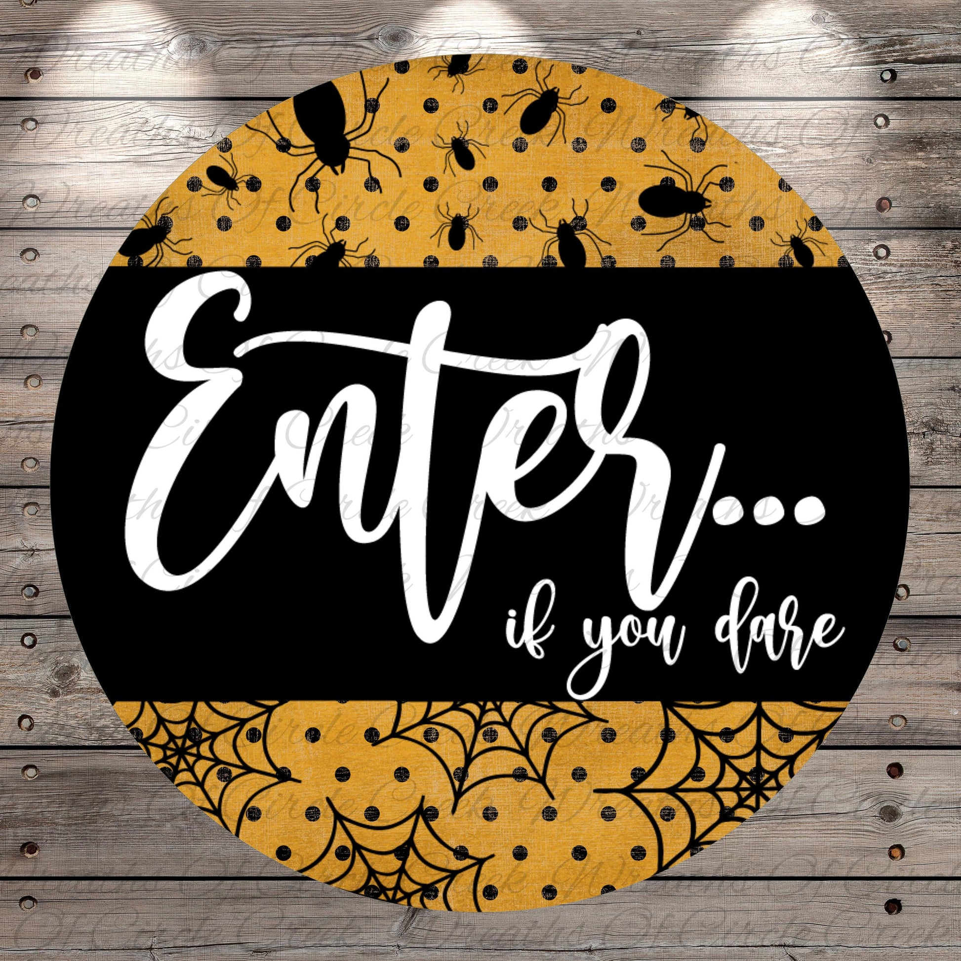 a circular sign with a black background and a yellow and black patterned design. The sign has the text "Enter... if you dare" written in white cursive font.