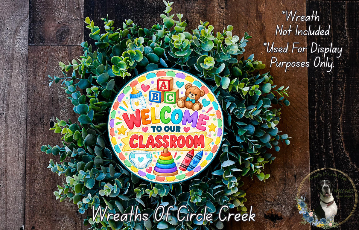 a colorful wreath with a sign that says "Welcome to our Classroom" surrounded by greenery.