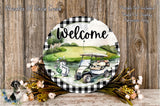 a welcome sign with a golf cart and flowers, set against a wooden background.