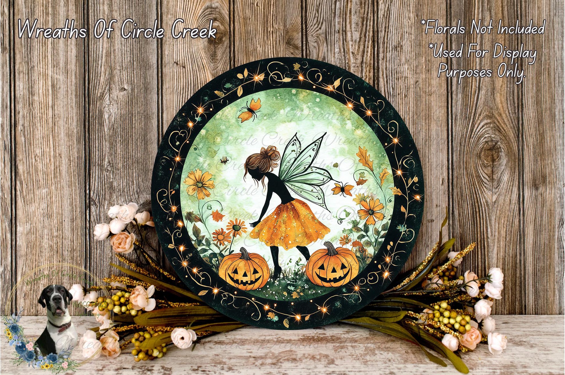 A decorative plate featuring a fairy with wings and a pumpkin, surrounded by flowers and a wooden background.