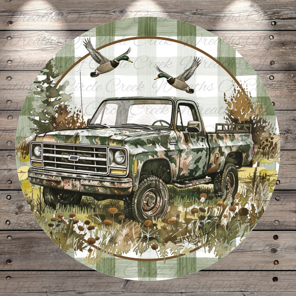 A camouflage truck is depicted in a wooded area, with two ducks flying above it.