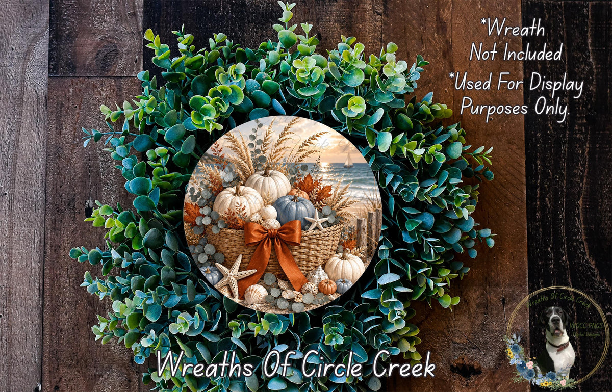 The image is a wreath made of various natural elements, including green leaves, white pumpkins, and a starfish, arranged in a circular pattern. The wreath is displayed on a wooden surface, and there is a small dog visible in the bottom right corner of the image.