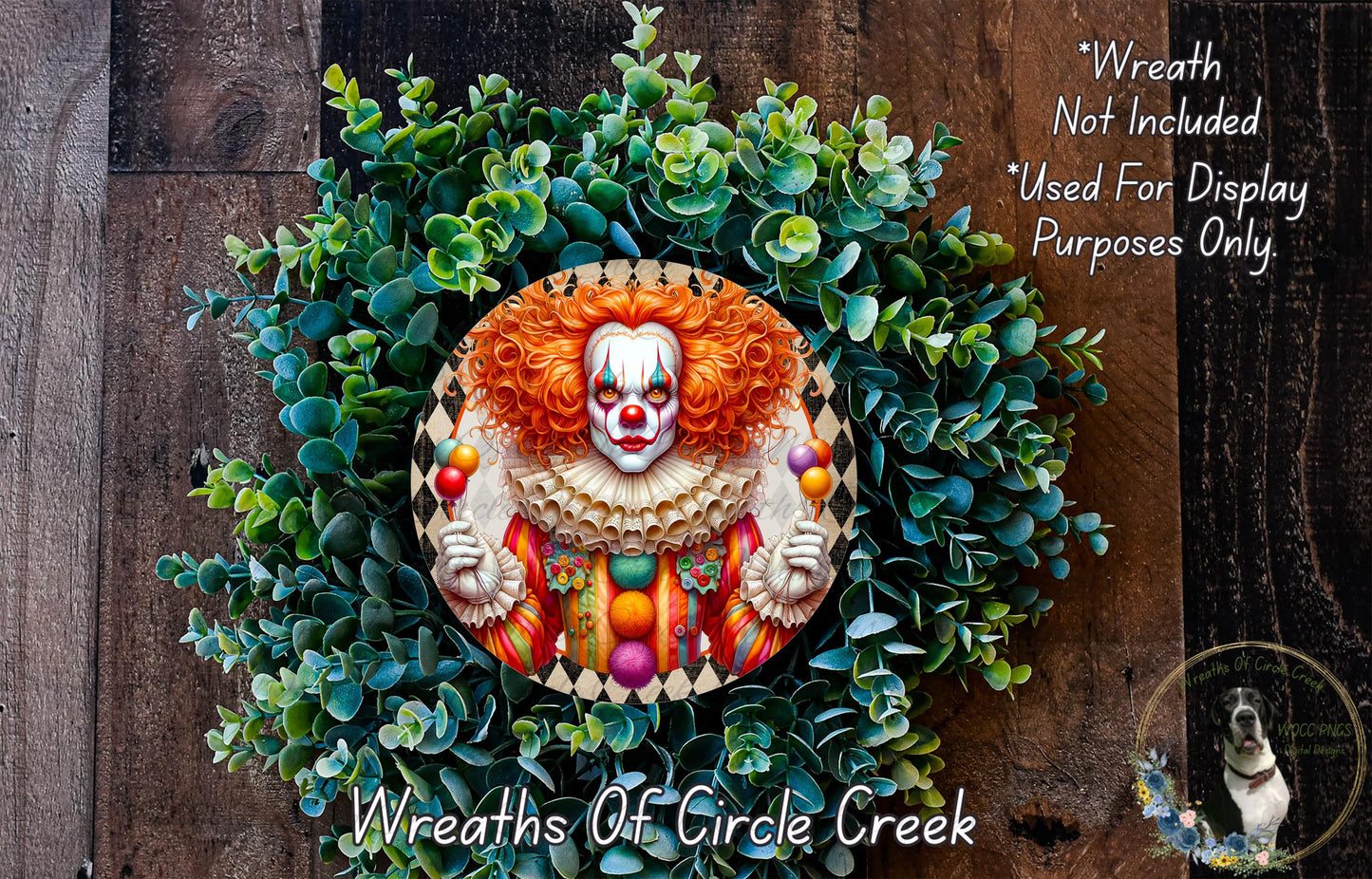 A wreath featuring a clown face surrounded by greenery, with a wooden background.