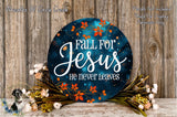 a circular sign with the text "Fall for Jesus he never leaves" surrounded by a floral arrangement and a wooden background.