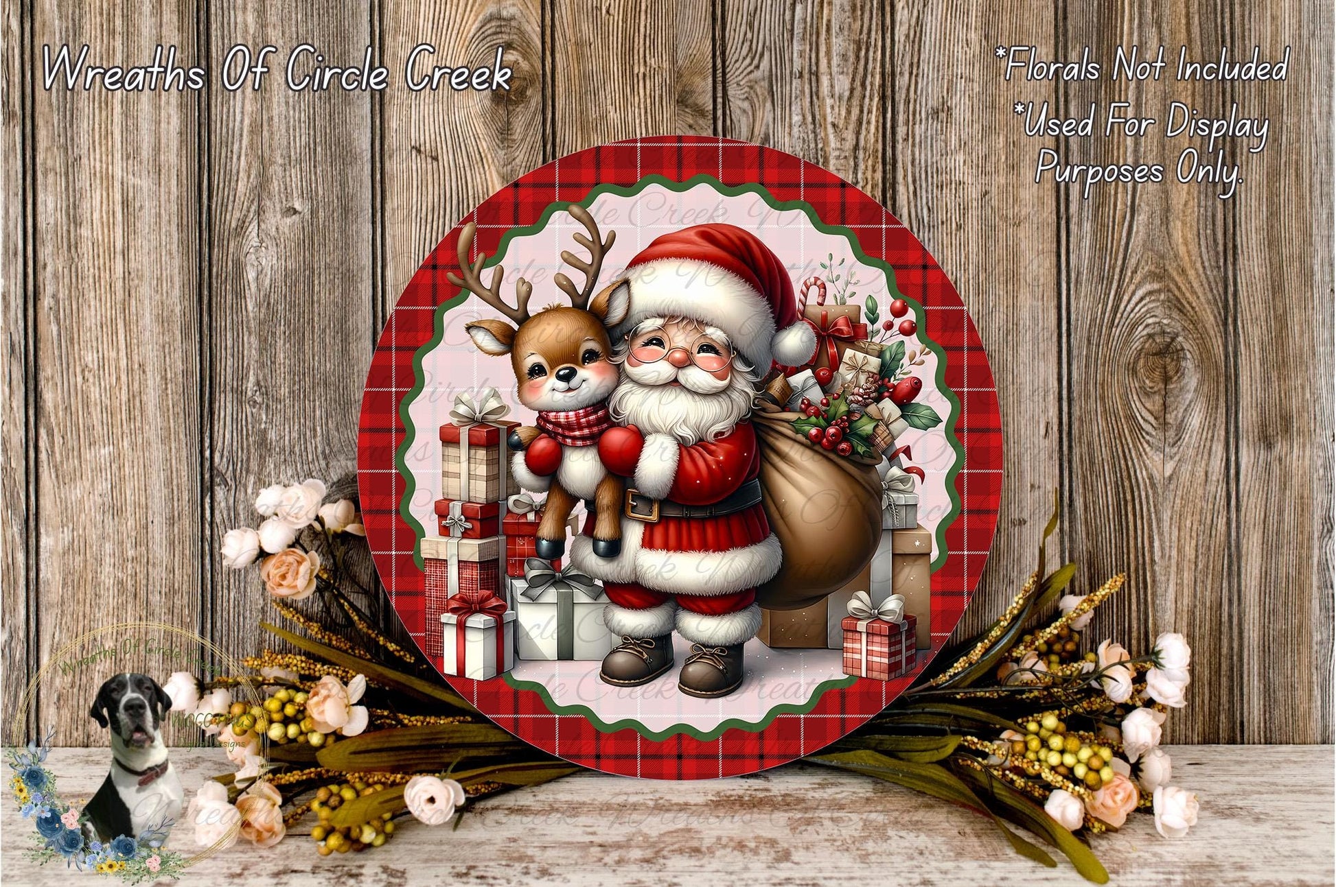 A festive Christmas scene featuring Santa Claus holding a reindeer and a sack of presents, surrounded by a wreath of flowers and a wooden background.