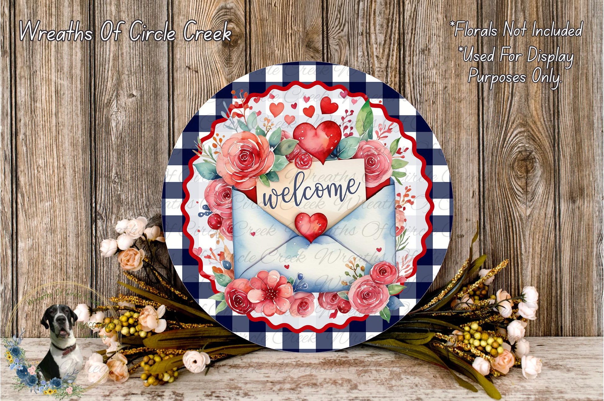 a decorative round sign with a floral design, surrounded by a bouquet of flowers and a wooden background.