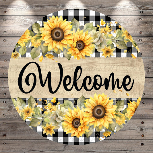 A circular sign with a floral design and the word "Welcome" written on it.