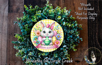a wreath with a bunny and flowers, surrounded by greenery, and a sign that reads &quot;Happy Easter&quot;.