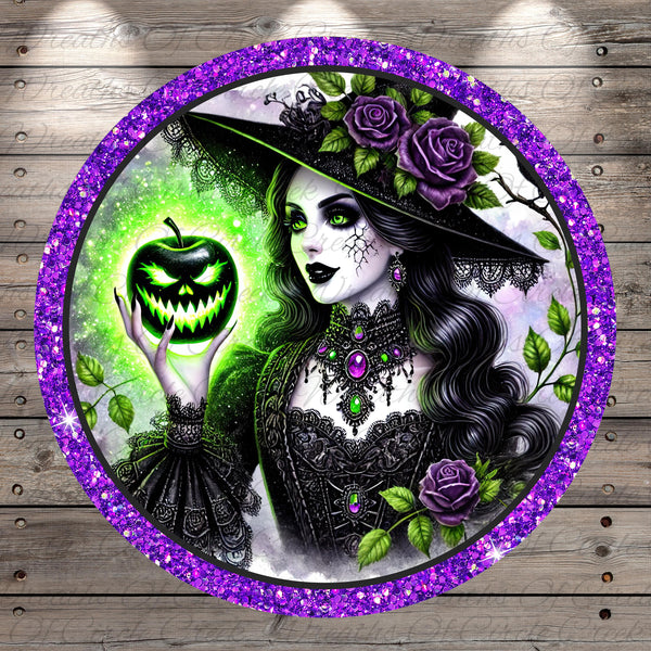 A digital illustration of a woman with long, dark hair wearing a black dress and a black hat with purple flowers. She is holding a carved pumpkin with a green face. The background features a purple border and green leaves.