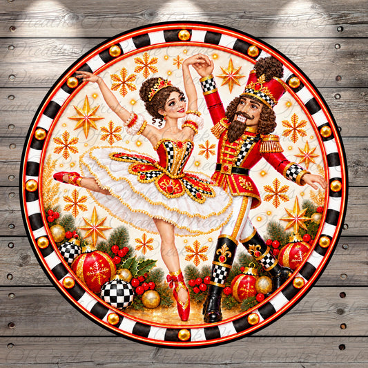 A decorative plate featuring a dancing nutcracker and a ballerina, surrounded by festive ornaments and a snowy background.