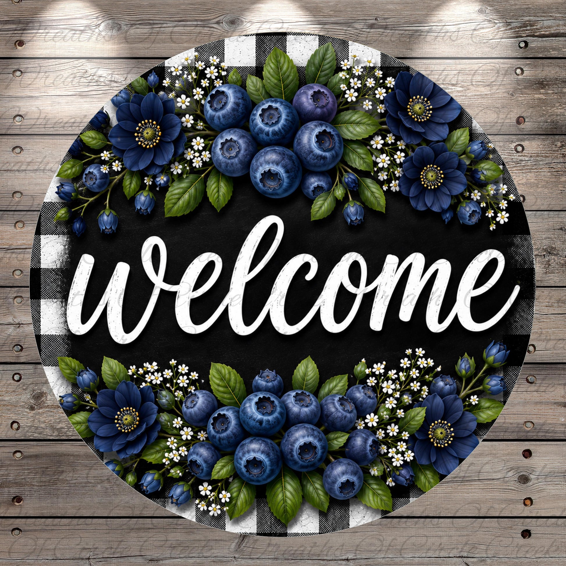 A circular welcome sign with a black background and white text, surrounded by blue flowers and leaves.