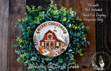 A wreath made of green leaves and a red and white house with a Santa Claus figure, surrounded by the text "Merry Christmas" and "Wreaths of Circle Creek".