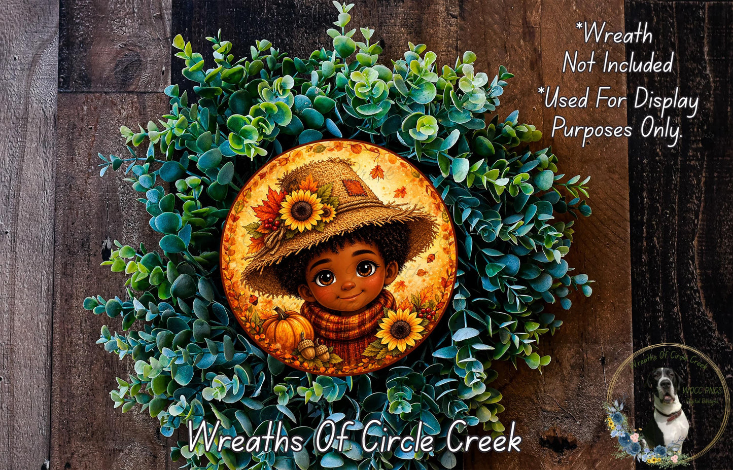 A wreath made of green leaves and flowers, with a circular frame featuring a cartoon character wearing a straw hat and holding a pumpkin.