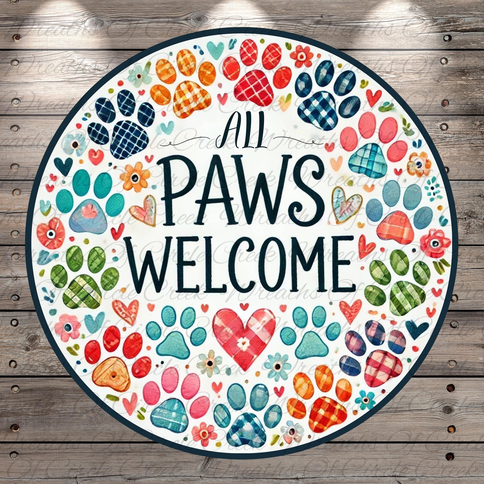 The image is a circular sign with a wooden background, featuring a variety of colorful paw prints and hearts surrounding the text "All Paws Welcome".