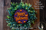 A Halloween wreath made of green leaves and orange pumpkins, with the text "Happy Halloween" displayed on it.