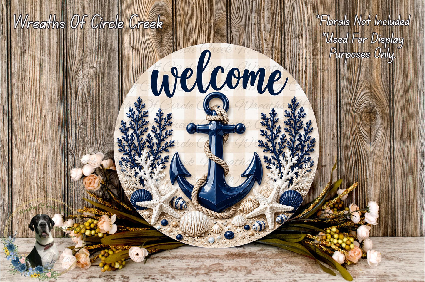 a round wooden sign with the word "welcome" written on it, surrounded by various nautical elements such as an anchor, seashells, and flowers. The sign is placed on a wooden surface, and there is a small dog in the bottom left corner of the image.