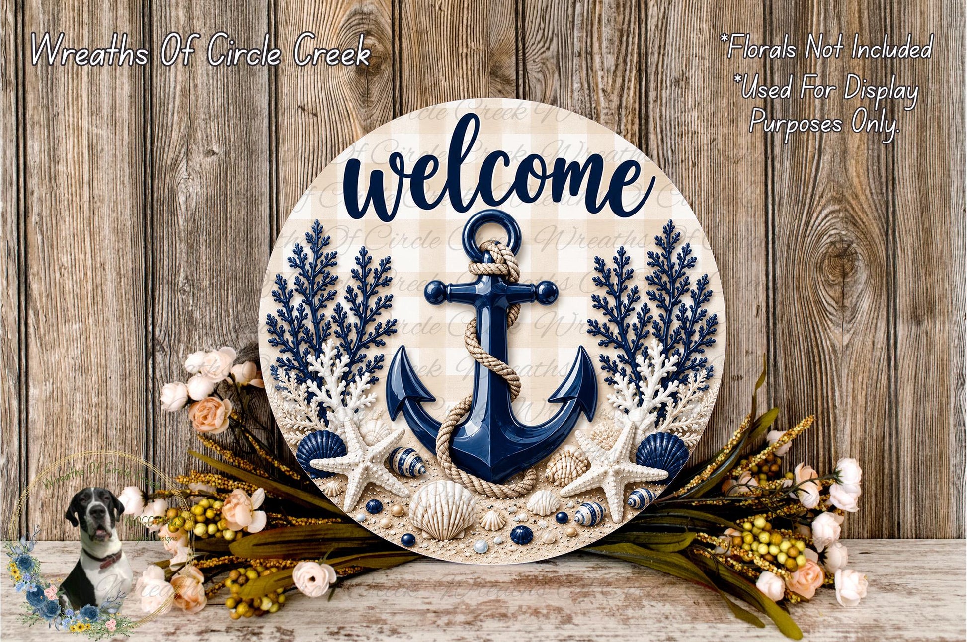 a round wooden sign with the word "welcome" written on it, surrounded by various nautical elements such as an anchor, seashells, and flowers. The sign is placed on a wooden surface, and there is a small dog in the bottom left corner of the image.