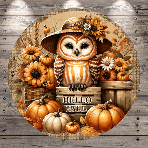 A round wooden sign with the text "Hello Fall" surrounded by an assortment of autumn-themed objects, including pumpkins, flowers, and a large owl wearing a hat.