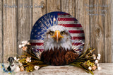 A patriotic eagle head is displayed against an American flag backdrop, surrounded by flowers and foliage.