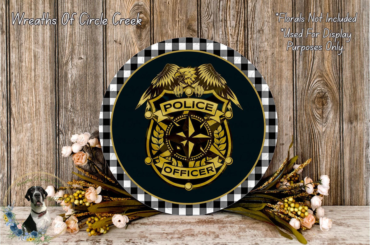 a round sign with a police officer's badge, surrounded by flowers and a wooden background.