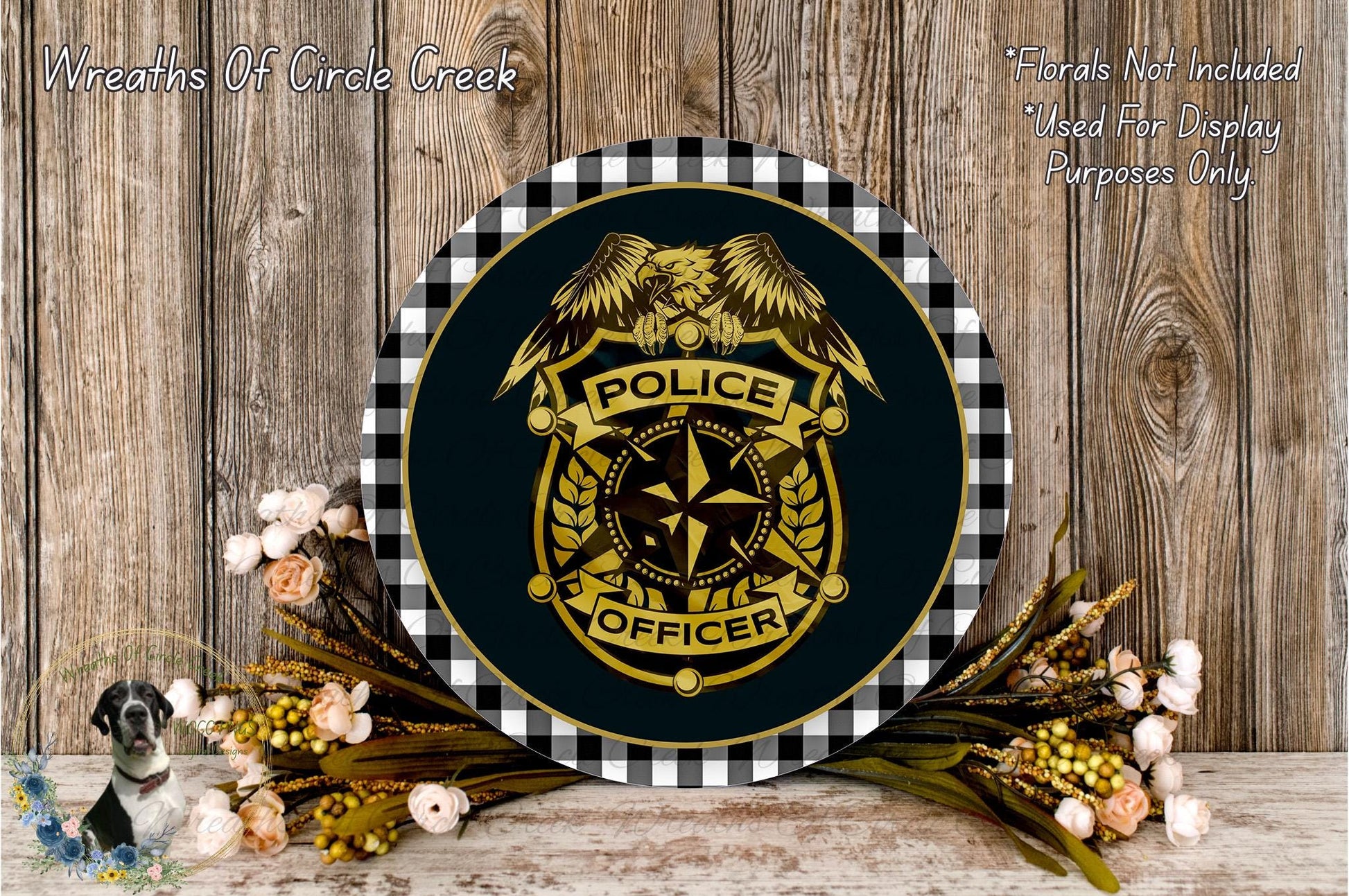a round sign with a police officer's badge, surrounded by flowers and a wooden background.