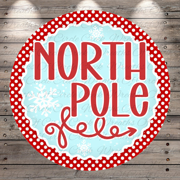 A circular sign with the text "NORTH P Pole" written in a decorative red font, surrounded by a red border with white polka dots.