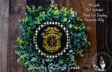 A wreath made of green leaves and a police officer badge, with the text "Wreath Not Included * Used For Display Purposes Only" and "Wreaths Of Circle Creek" below it.