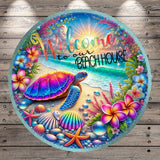 A colorful and vibrant welcome sign featuring a tropical beach scene with a turtle, flowers, and other sea creatures.