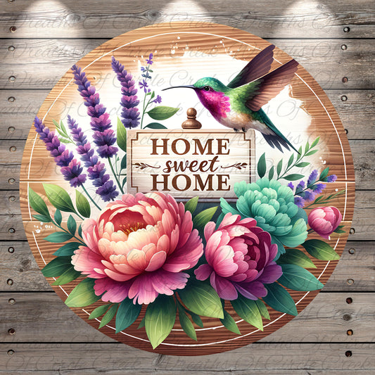A wooden sign with the text "HOME SWEET HOME" surrounded by a vibrant floral arrangement, including pink peonies, purple lavender, green peonies, and a hummingbird.