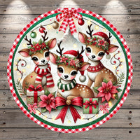 A festive Christmas-themed illustration featuring three adorable deer wearing Santa hats and scarves, surrounded by holiday decorations such as poinsettias, presents, and a bow.