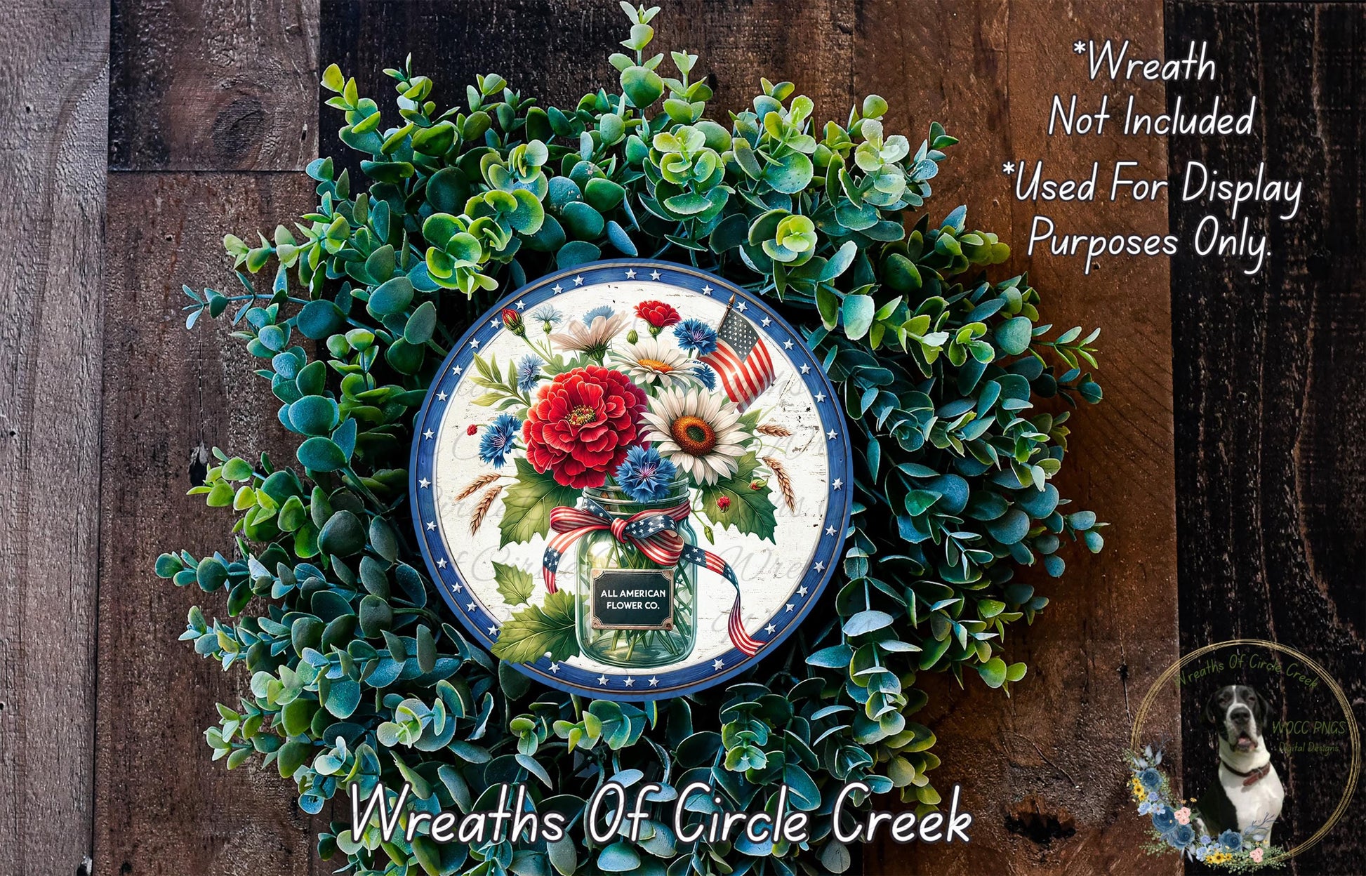 a wreath made of various green plants and flowers, with a decorative plate in the center displaying a floral arrangement.