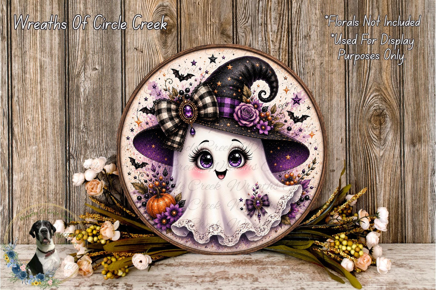 A decorative Halloween-themed wreath featuring a smiling ghost wearing a witch's hat and surrounded by autumn foliage, flowers, and a pumpkin.