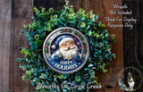 A wreath made of green leaves and a Santa Claus figurine, with the text "Happy Holidays" displayed on it.