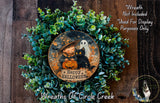 a wreath with a picture of a witch on it