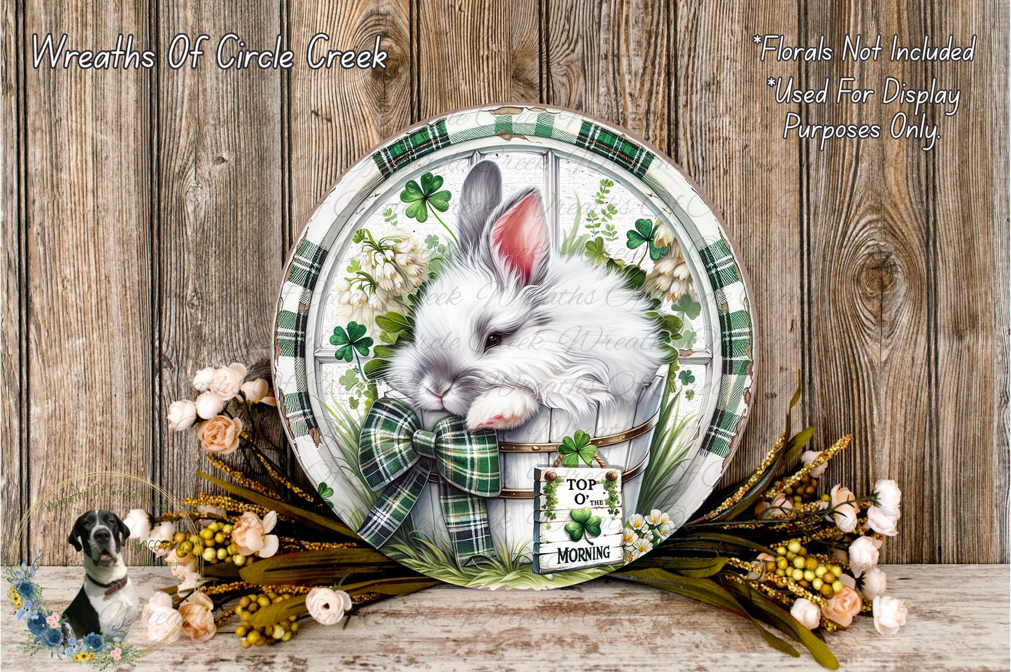 A decorative plate featuring a white rabbit surrounded by a floral arrangement and a sign that reads "Top of the Morning".