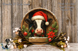 A black and white cow wearing a Santa hat is surrounded by a wreath of flowers and greenery, with a wooden frame. The background is a wooden wall with snowflakes falling.