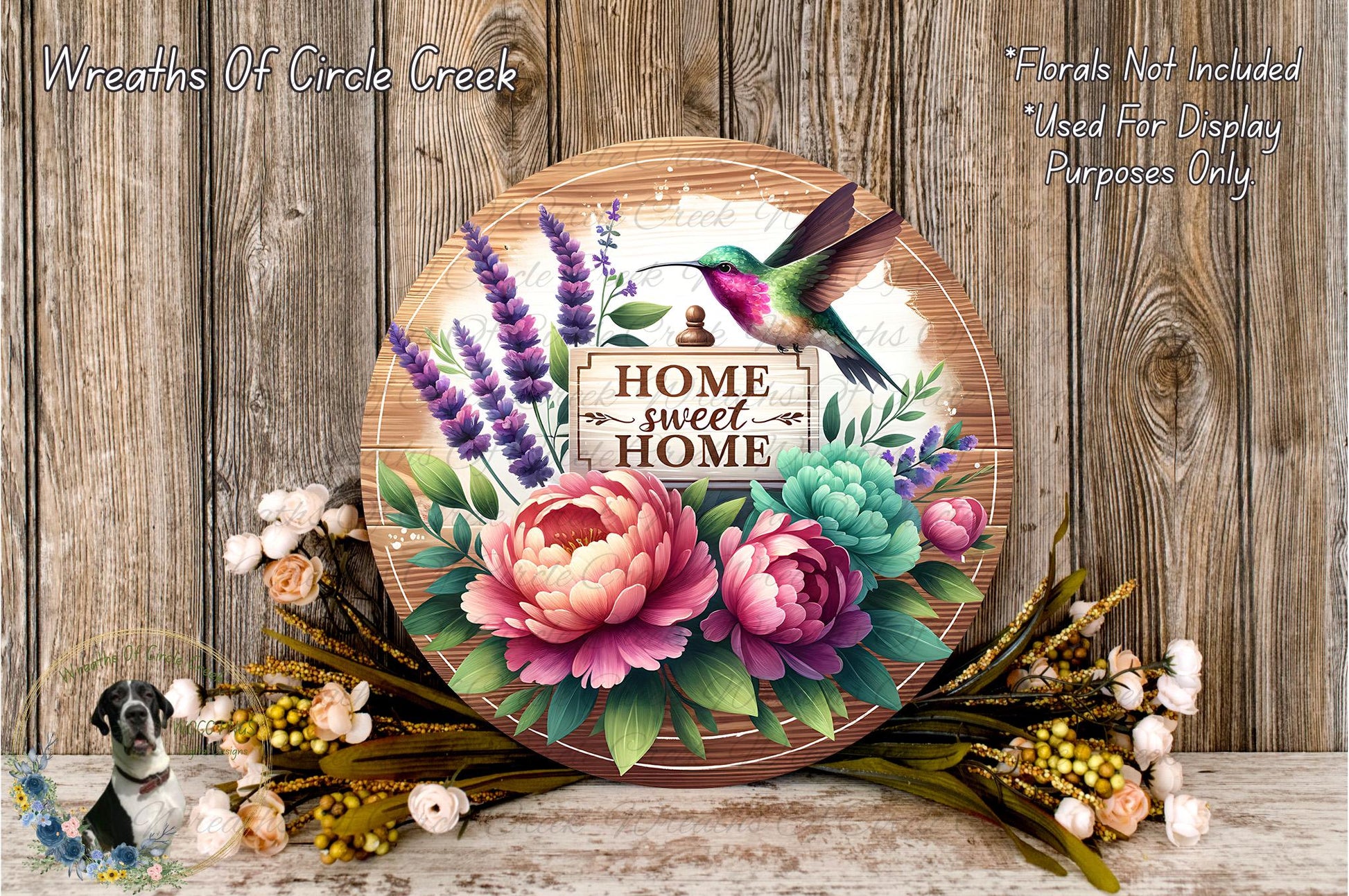 a wooden sign with a colorful bird perched on it, surrounded by a variety of flowers and greenery. The sign reads "HOME SWEET HOME" and is placed on a wooden surface.