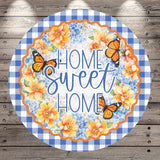 A decorative sign with the text "Home Sweet Home" surrounded by a floral border and butterflies.