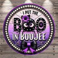 A decorative Halloween-themed sign with the text "I PUT THE BOO IN BOUJEE" and a black and purple spider-like character.