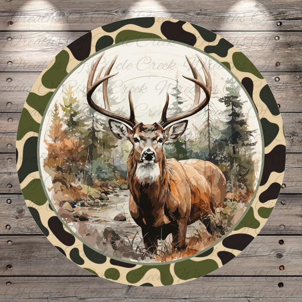 A deer with large antlers stands in a forest setting, surrounded by trees and foliage.