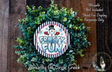 A wreath made of green leaves and a snowman decoration, with the text "FROSTY FUN" displayed on it.