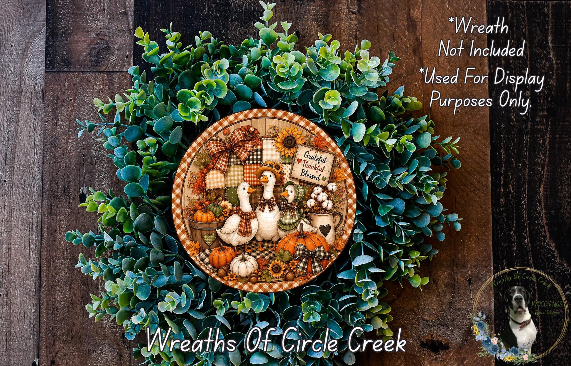 a wreath made of green leaves and various fall-themed decorations, including a sign that says "Grateful for the Blessing".