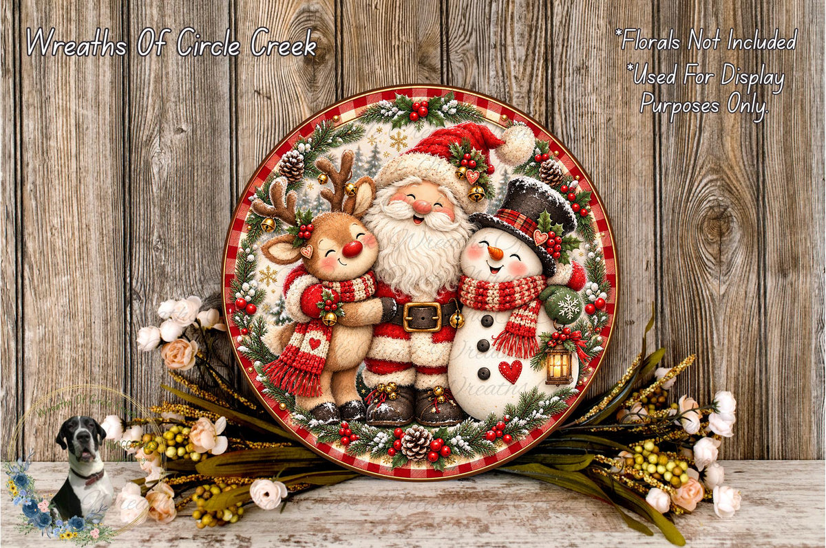 A festive Christmas wreath featuring Santa Claus, a reindeer, and a snowman, surrounded by flowers and greenery, with a wooden background.