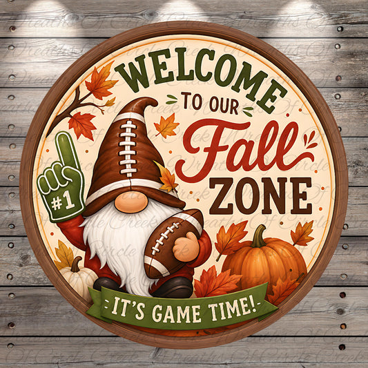 a circular sign with a football and autumn leaves, along with a gnome holding a football. The sign reads "Welcome to our Fall Zone" and "It's Game Time!"