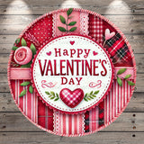 A circular, decorative plate with a "Happy Valentine's Day" message in the center, surrounded by various floral and patterned elements such as roses, leaves, and plaid fabric.