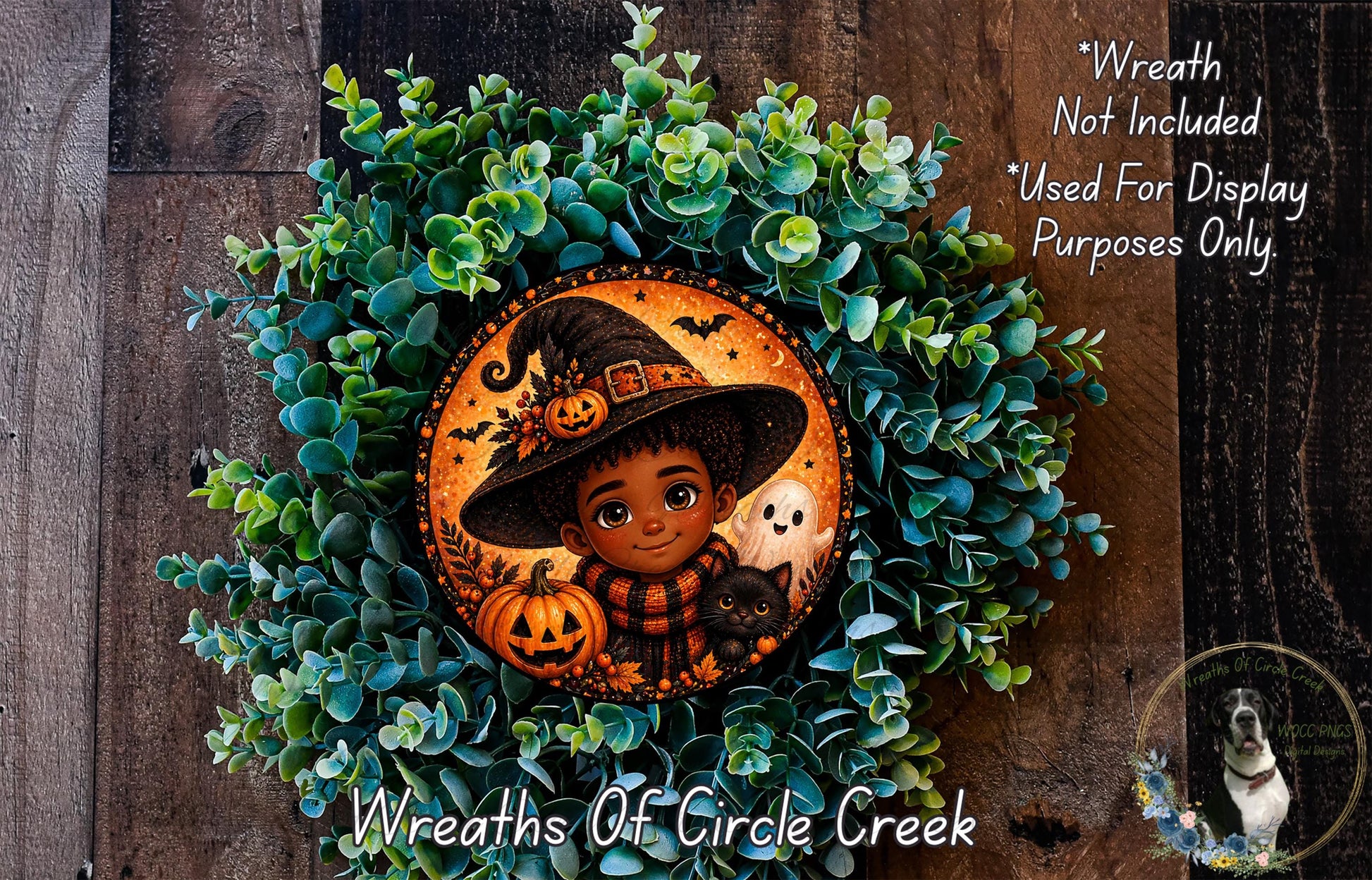 A wreath featuring a young girl wearing a witch's hat, surrounded by green foliage and a jack-o-lantern.