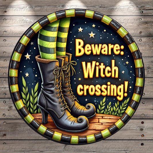 A pair of tall, pointed boots with green and black striped socks, set against a night sky with stars and plants, and a warning text that reads "Beware: Witch crossing!"