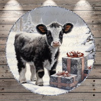 A black and white cow stands in a snowy landscape, surrounded by three gift boxes with red bows, creating a festive scene.