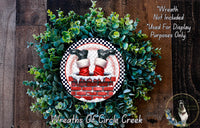 A wreath made of green leaves and red bricks, with a pair of Santa Claus shoes on top of the brick chimney.